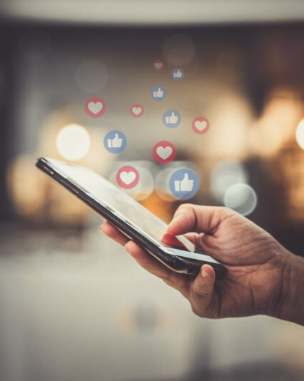 Hand using smartphone with Social media concept.
