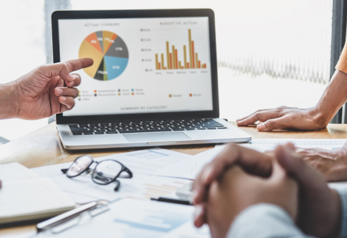 Business team collaboration discussing working analyzing with financial data and marketing growth report graph in team, presentation and brainstorming to strategy planning making profit of company.